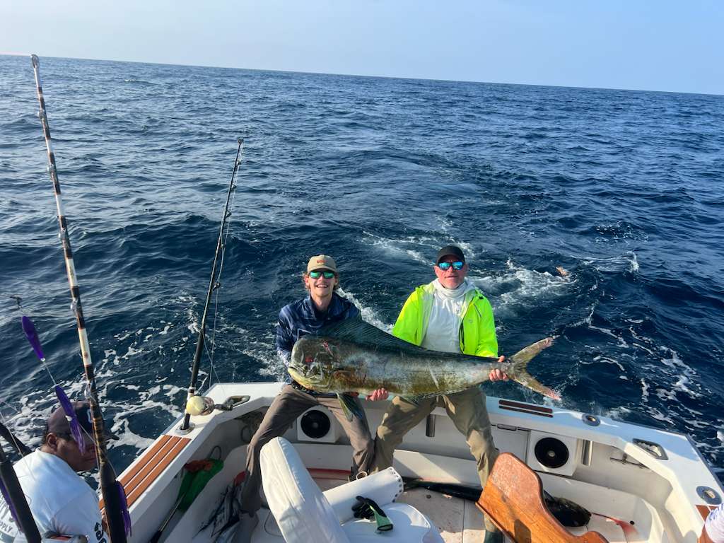 Two guests with a dorado