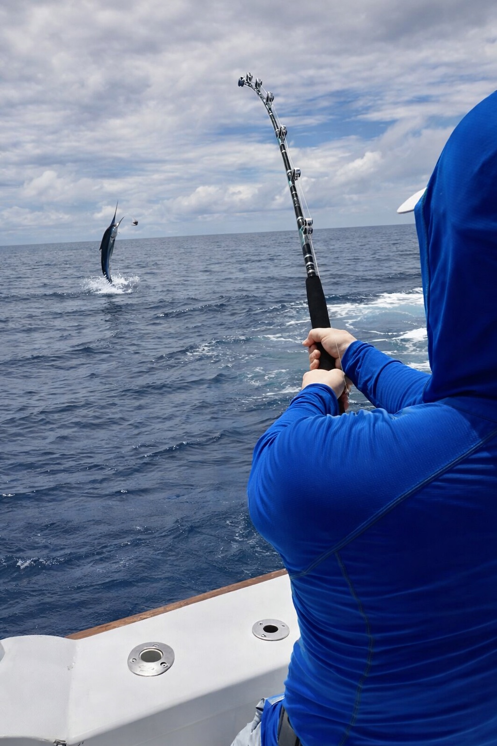 Angler fighting a jumping marlin